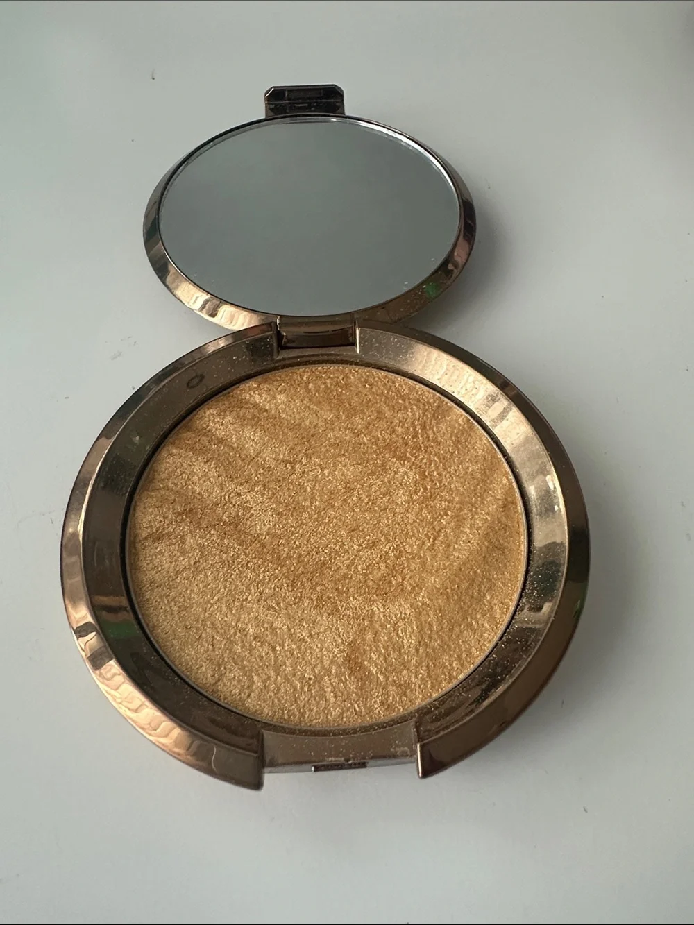 BECCA Round Metallic Compact in Silver and Rose Gold Accent